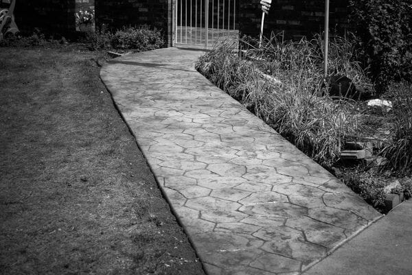 bc-random-stone-stamped-concrete-path-walttools-black-and-white